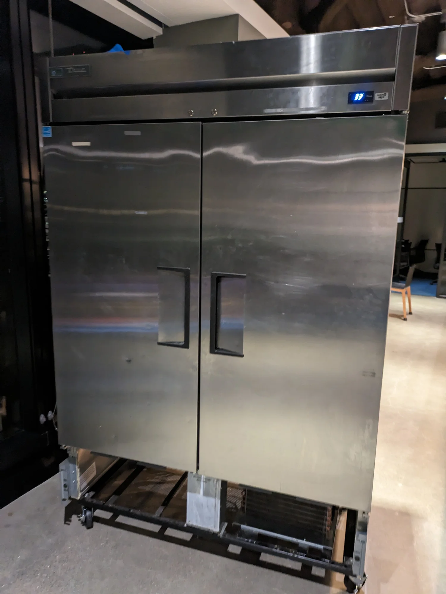 Technician installing commercial kitchen equipment