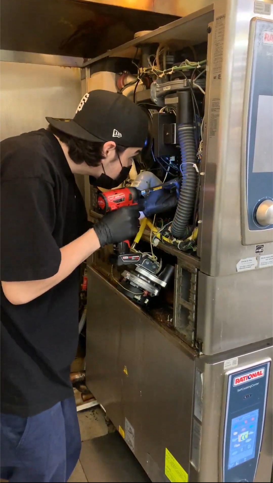Reliance Appliances technician repairing a commercial appliance