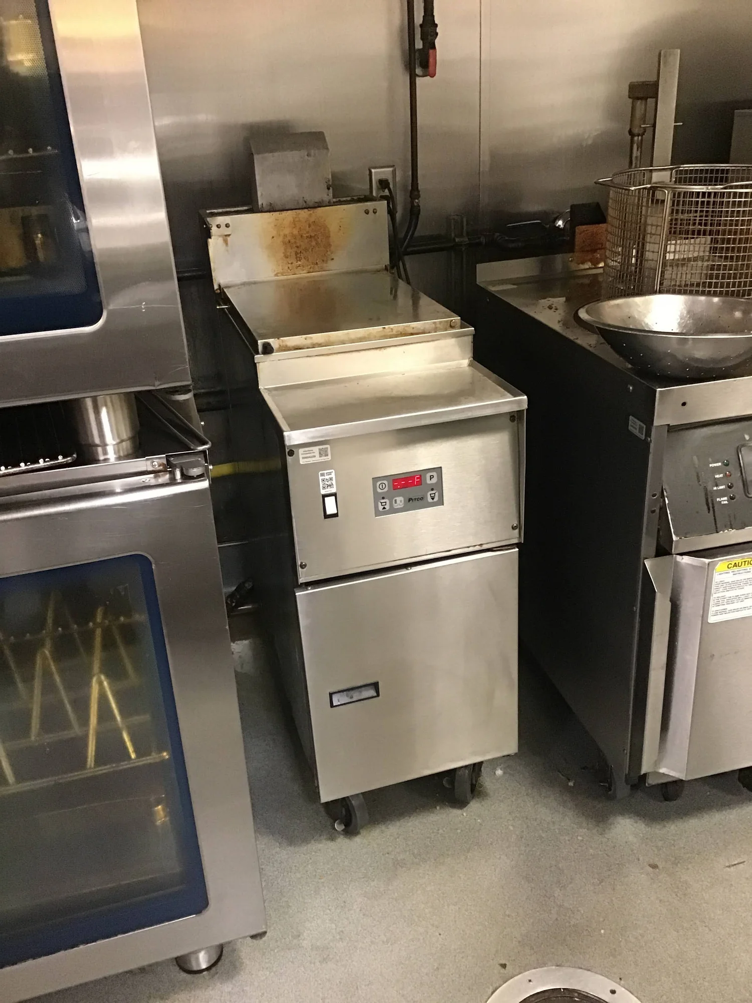 Technician servicing a commercial oven